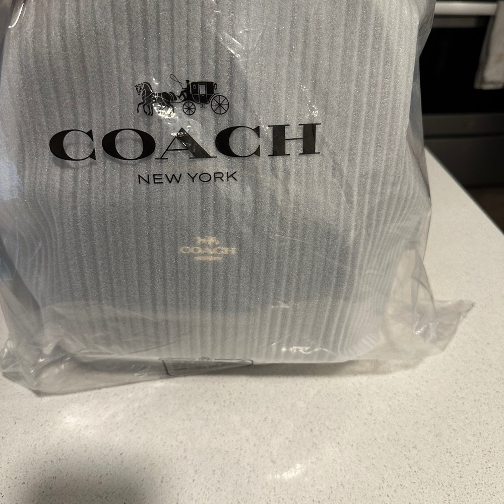 Brand new never used Coach Court backpack